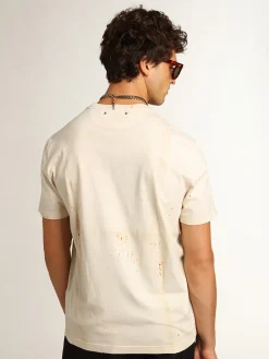 Fashion Camiseta masculina marfim com inscrição e detalhes desgastados Camisetas