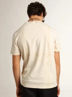Fashion Camiseta masculina marfim com inscrição e detalhes desgastados Camisetas