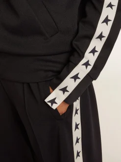 Store Moletom azul-escuro com zíper e fita branca e estrelas em contraste MULHER Moletons